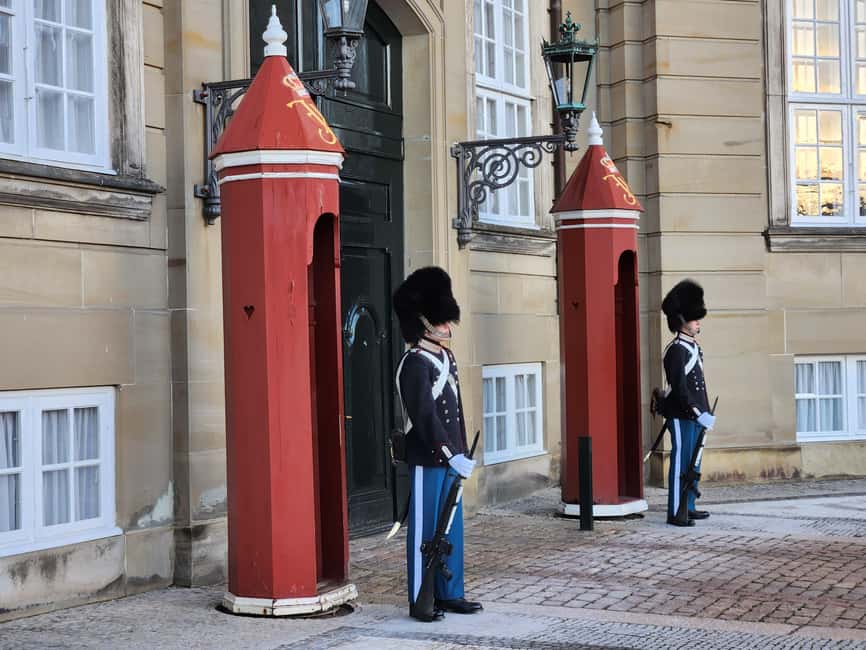 Copenhagen Combo: Walking Tour, Harbor Ferry & Royal Guards - Starting beneath Copenhagen Central Station’s clock