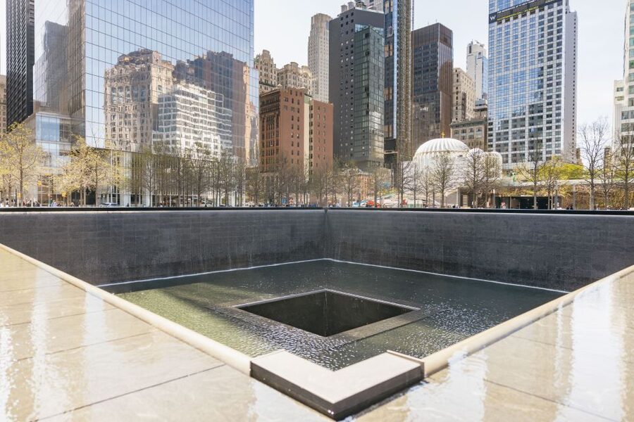 NYC: Wall Street Tour with 9/11 Memorial and Statue Ferry - Trinity Church and the stories behind the streets