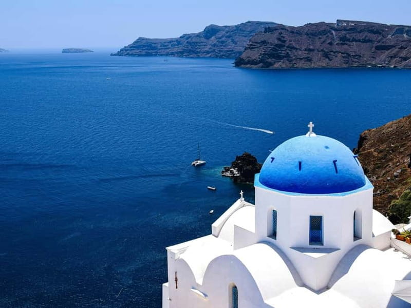 Santorini Guided Day Trip From Crete with Ferry Tickets - Oia: famous views, blue domes, and a strict clock